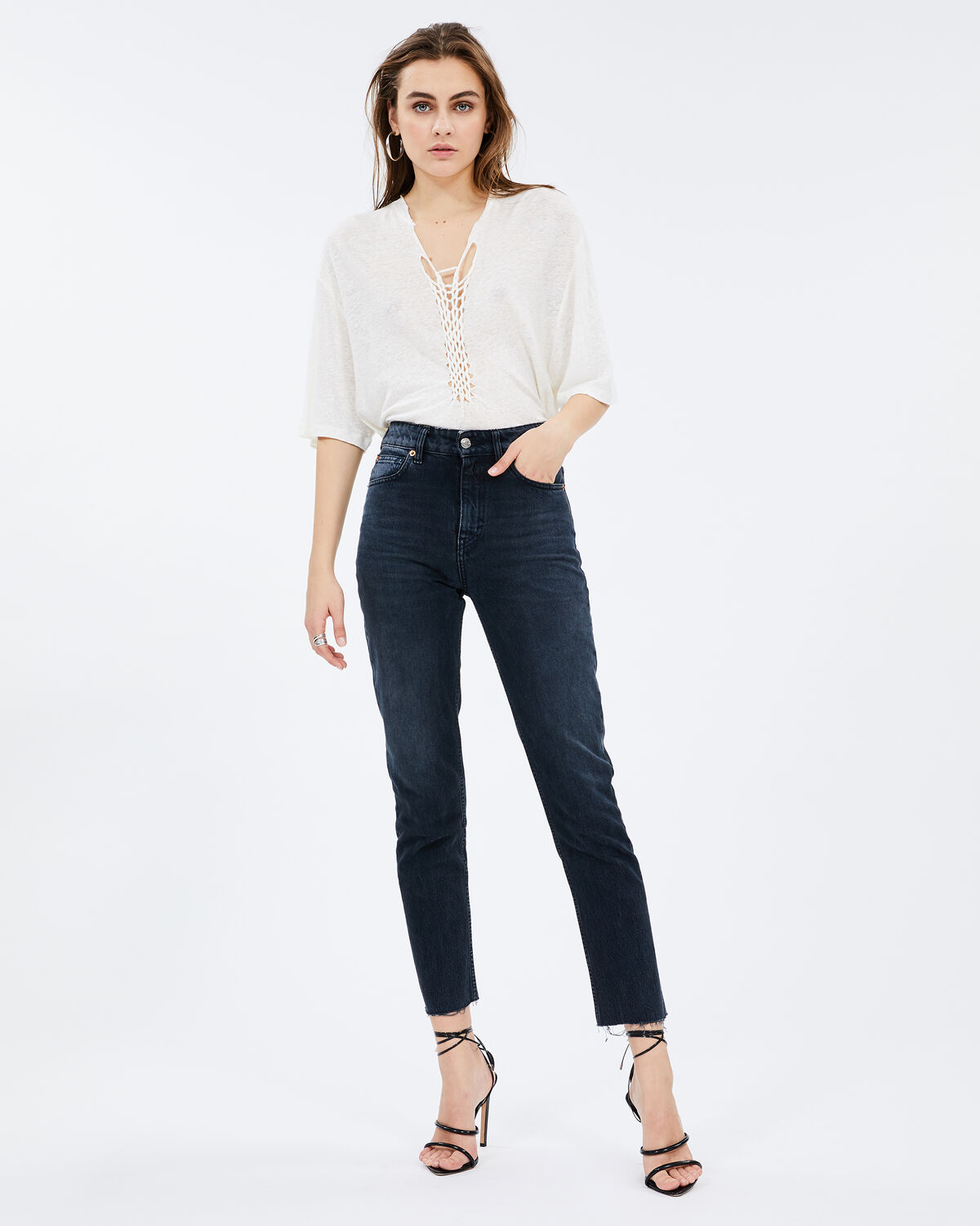 Photo of IRO Paris Kind T-Shirt Off White - This Linen Top Is Distinguished By Its Frayed Details And Slightly Oversized Fit. Its Braiding Set Will Enhance Your Neckline. For A Casual Look, Wear It With Raw Jeans And For A More Elegant Look, Combine It With A Leather Skirt. T-Shirts