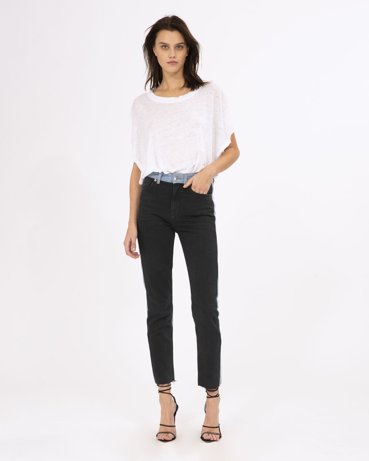 Photo of IRO Paris Reverent Jeans Black And Blue Denim - These Two-tone Slim-cut Jeans Are Characterized By Their High Waist And Will Perfectly Fit Your Curves. Combine Them With An Oversized White T-shirt And A Pair Of Heel Sandals For An Effortless Look. Spring Summer 19