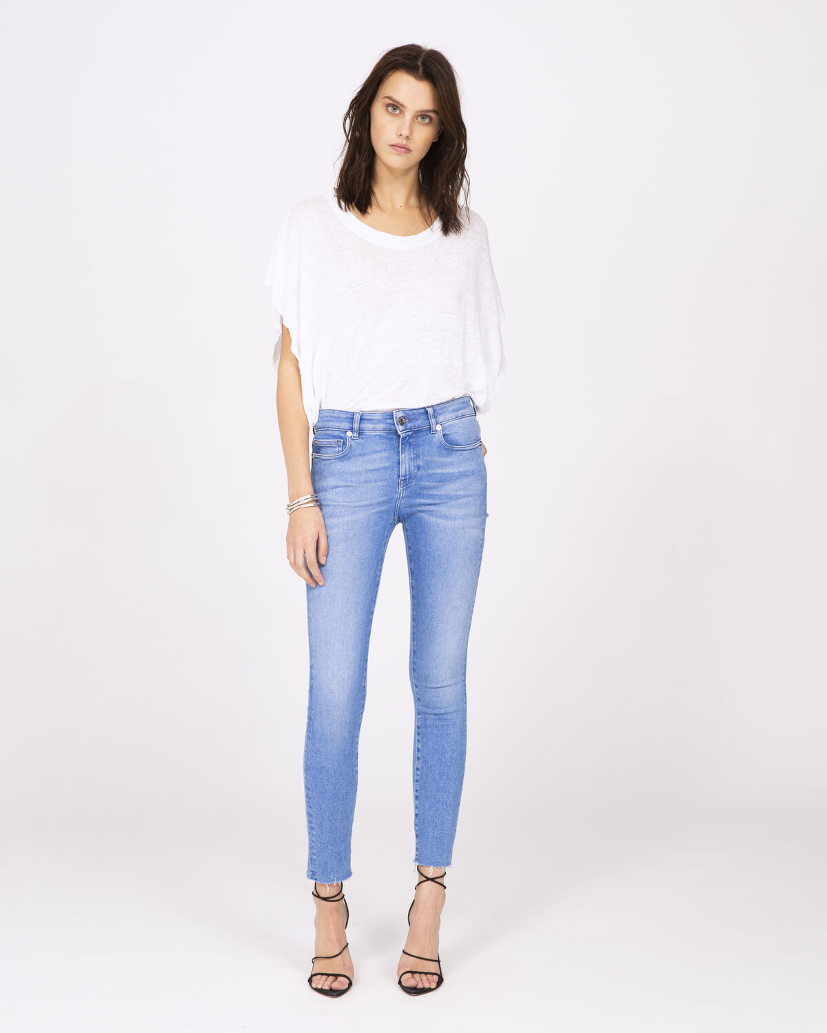 Photo of IRO Paris Rash Jeans Light Blue Denim - These Faded Blue Slim Jeans Are Distinguished By Their Sharp Edges And Frayed Details. Combine Them With A Loose T-shirt And A Pair Of Pumps For An Effortless Look. Spring Summer 19