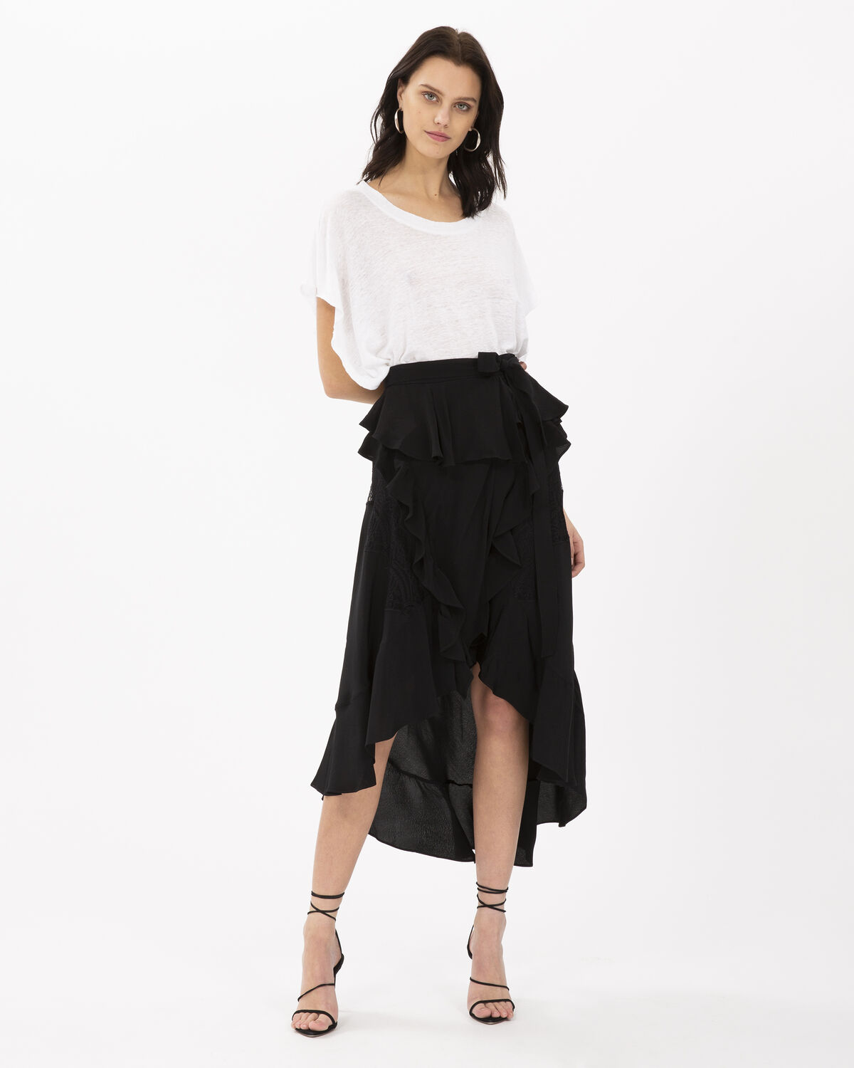 Photo of IRO Paris Breathed Skirt Black - Fluid And Lightweight, This Asymmetrical Mid-length Skirt Reflects The Flamenco Spirit. Belted At The Waist With Its Multiple Ruffles And Embroideries, It Will Be The Sparkling Touch Of Your Summer Outfits. Spring Summer 19