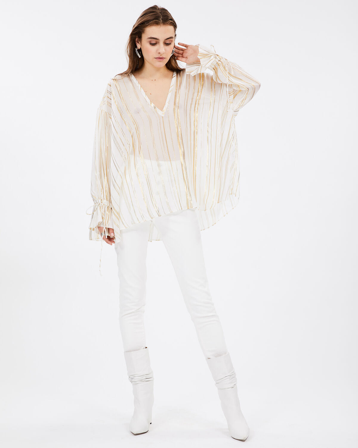 Photo of IRO Paris Adore Top Ecru - Light And Fluid, This Transparent Top Is Distinguished By Its Fine Lurex Stripes And Oversized Fit. Tightenable At The Wrists, Wear It With White Skinny Jeans For A Modern Look. New In